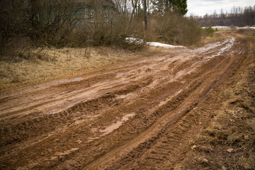 Blurred Russian dirt road in a field