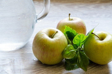 green apples and glass of water