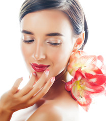 young pretty brunette woman with red flower amaryllis close up isolated on white background. Fancy fashion makeup, bright lipstick, creative Ombre manicured nails. spa skin care