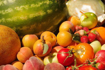 A lot of vegetables and fruits are laid out on the table 