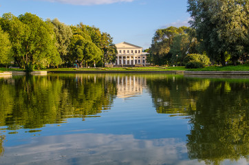 Fototapeta na wymiar September, 2013, Saint-Petersburg, Russia: View through the pond to the Yusupov Palace. Yusupov Garden and the Palace of Prince Yusupov