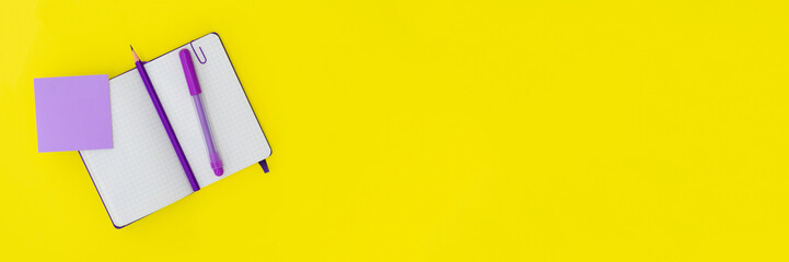 Purple notepad and pens.