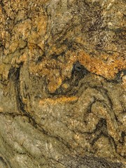 The background is undulating structurally stone marble corrosion.