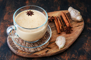 Masala tea on a clay table with spices. Top view