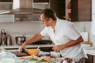 Man cooking in the kitchen © Milena