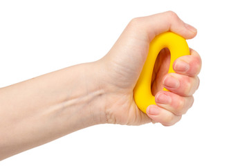 Yellow and orange expander in woman hand isolated on white background.