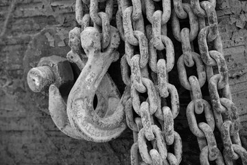 A large rusty chain with hooks. Close up. Background, texture.