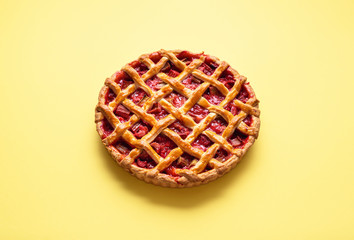 Strawberry and rhubarb pie with a lattice crust. Fruits dessert