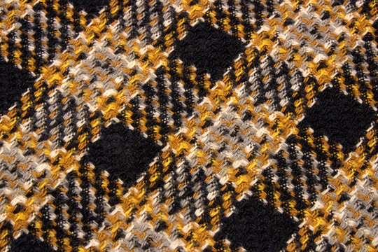 Macro, close-up of plaid textile part for texture, pattern and background.