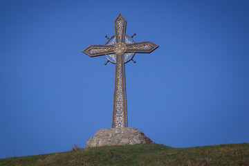 big iron cross against the sky