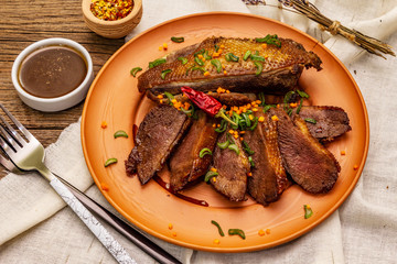 Roasted duck breasts, spices and Demi-glace sauce. Traditional French food