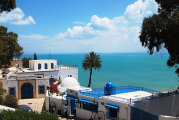 View of the white and blue houses, the azure sea and the blue sky. Sidi Bou Said, Tunisia