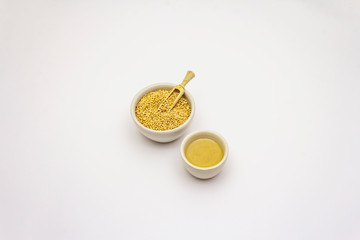 Tahini with sesame seeds isolated on white background