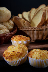 Beautiful loaves and pastries in low light on black background