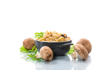vegetarian cooked rice with mushrooms in a ceramic bowl