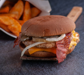 different options for serving a hamburger with cheese, bacon, cutlet, and sauce