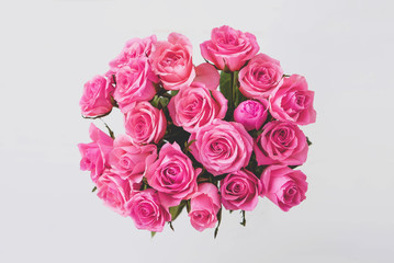 Beautiful bouquet of fresh coral pink roses in full bloom.
