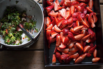 Preparing strawberries on a tray 