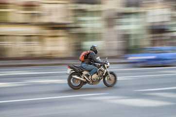 Obraz na płótnie Canvas Fast motorcycle riding around the city.