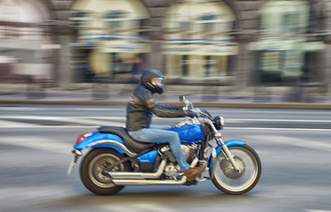 Fototapeta na wymiar Fast motorcycle riding around the city.