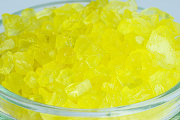 Spa cosmetic and beauty treatment concept. Yellow spa sea salt in a glass jar.