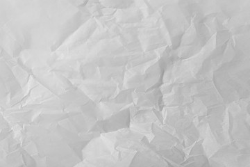 abstract background of crumpled white parchment texture close up
