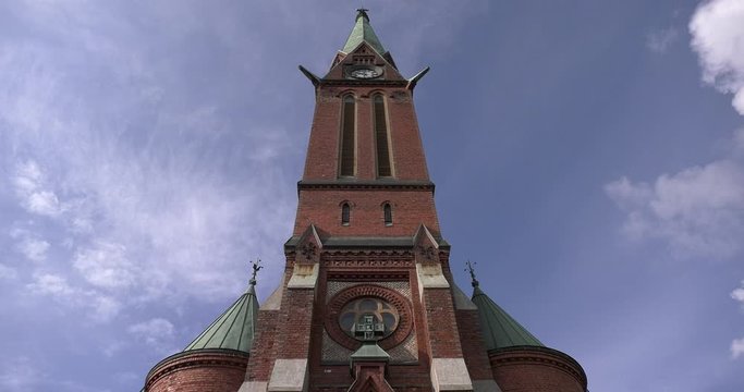 4K Helsinki church tower on cloudy summer day video in Finland, northern Europe