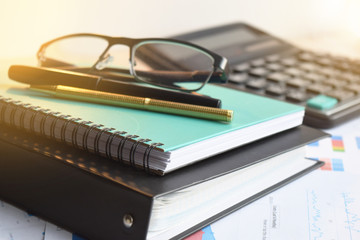 Calculator and pencil. Office equipment at workplace. Conceptual image of desk work, financial paperwork and business economy.