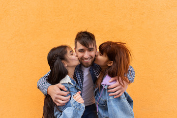 Young and happy father hugs his children, photo for Father's Day