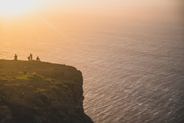 Fototapeta na wymiar Beautiful scenic sunset view on cliffs coast of Atlantic Ocean