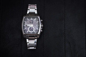 Luxury watch on black leather. Steel watch for business