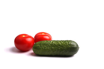 a cucumber and two tomatoes isolated