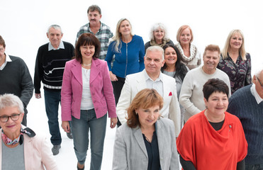Casual group of people walking isolated over a white background