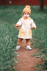 a little boy walks along the path.