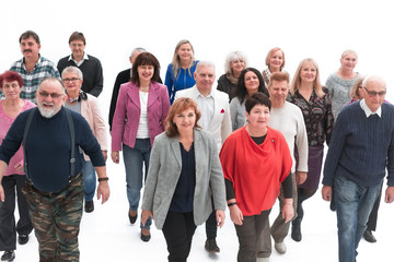Casual group of people walking isolated over a white background