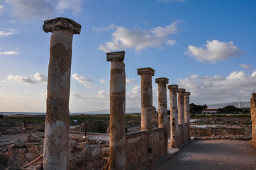 Archeological Park Kato Paphos and columns of House of Theseus on the sunset under the blue sky...