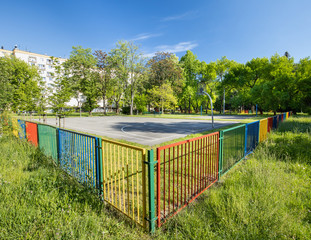 Nowa Huta district in Krakow.  Colorful fence, playground, recreation area in the city park