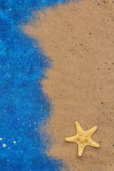 Summer background wish sand and sea star