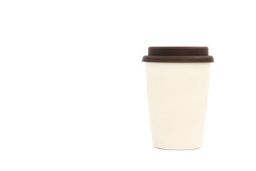 Reusable bamboo cup for coffee or tea to go. Isolated on white. Brown silicone cover.