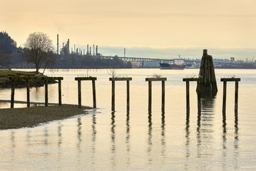 Fototapeta na wymiar Burrard Inlet Tanker and Oil Refinery. Oil Refinery and Tanker in Burrard Inlet. Vancouver, British Columbia, Canada.