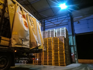 Pallet racks inside a cement plant. Loading shop of cement plant.
