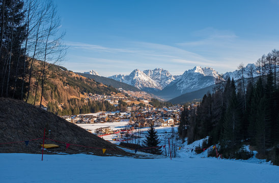 Winter landscape with a village Padola in the Dolomite mountains of the Alps, Comelico, Italy, January 2020