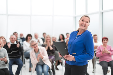 Businesswoman addressing colleagues at office meeting