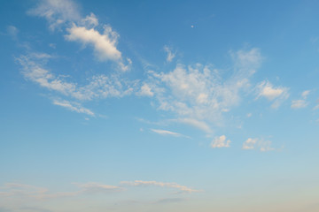 blue sky background with tiny clouds