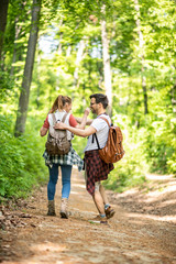 Fototapeta premium Man and woman hugging in a big forest