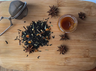 tea with honey cinnamon on wooden desk