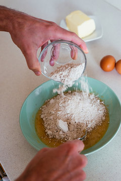 Young man making cookies at the kitchen