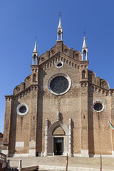 Fototapeta na wymiar August 2016 - Venice, Italy - Basilica dei Frari - Facade - Many works of art are housed inside, including two paintings by Titian.