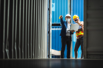 Businessmen, executives and engineers wear medical face masks. While inspecting industrial plants...