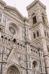 Close-up of the facade of the building of Santa Maria del Fiore in Florence, Italy.